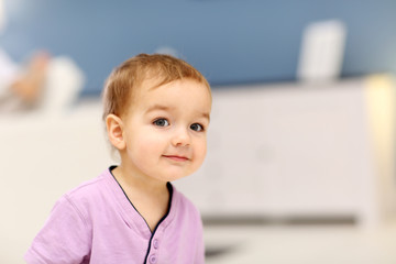 Portrait of cute baby in the room