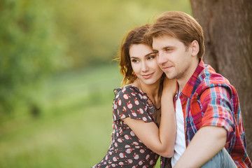 Loving couple on a meadow