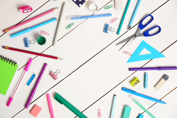 Flat lay of stationery on white wooden table background, copy space