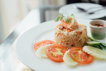 shrimp with fried rice on the dish