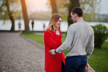 Obraz premium Marriage proposal. Man with boquet of flowers goes to meet his