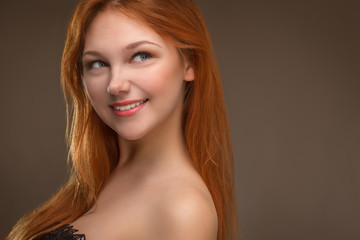 Naklejka premium beautiful young red-haired woman