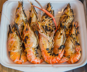 Grilled shrimps on foam box for lunch