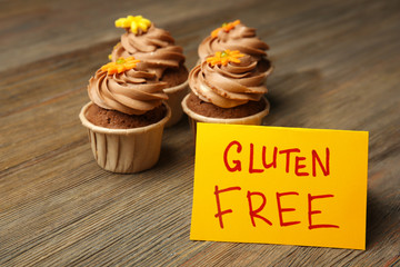 Gluten Free cupcakes on wooden background, close up