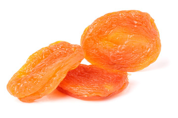 Naklejka na ściany i meble three dried apricots on a white background closeup