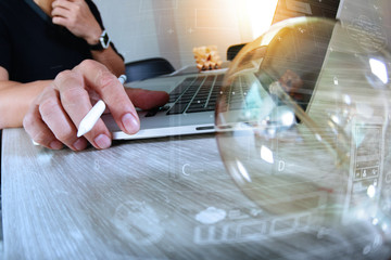 light bulb with designer hand working with laptop computer and c