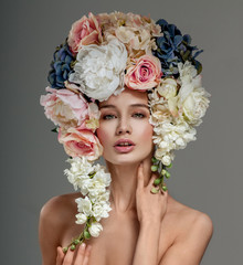 Naklejka premium Beautiful woman with flowers in her hair. Bouquet of Beautiful F