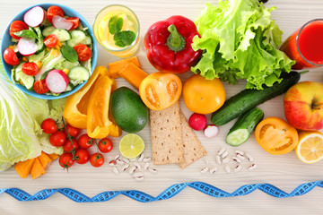 Fresh fruits and vegetables on wooden table, top view