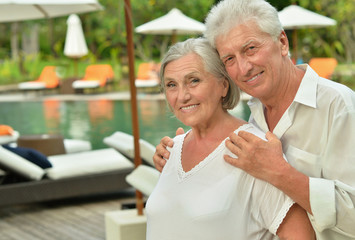 Senior couple near pool