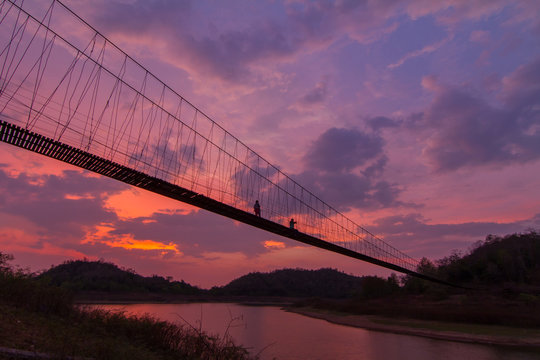 Fototapeta silhouette of rope bridge in the sunset time