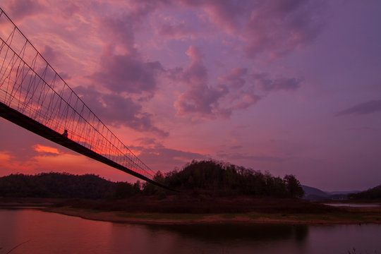 Silhouette Of Rope Bridge In The Sunset Time