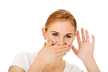 Shocked young woman overhears conversation