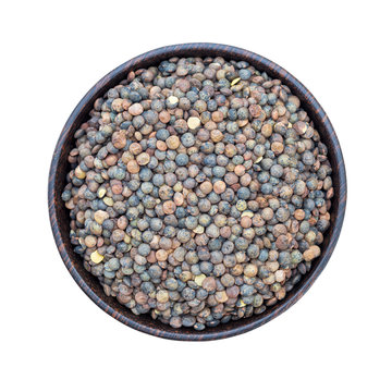 Organic French green lentils in bowl isolated on white background