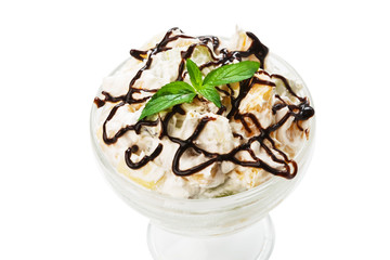 Delicious dessert - fruit salad mixed with cream