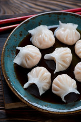 Dim sums with prawns and soy sauce, selective focus, close-up