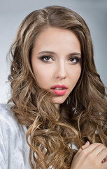 Portrait of a beautiful young woman with brown hair