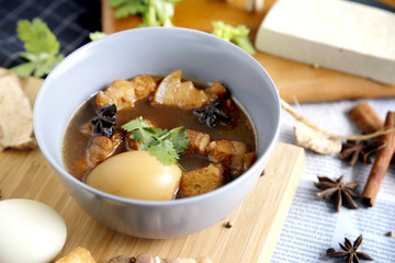 Thai cuisine (pa-lo).Eggs boiled soup with spices on wooden back