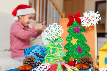 Girl making Christmas crafts
