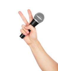 Hand holding a black microphone isolated on white