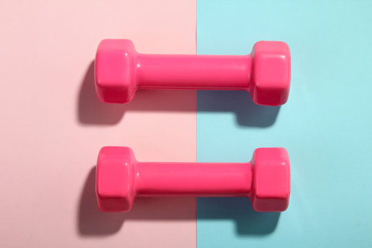 Beautiful Pink Weights For Fitness On Light Pink And Turquoise Background