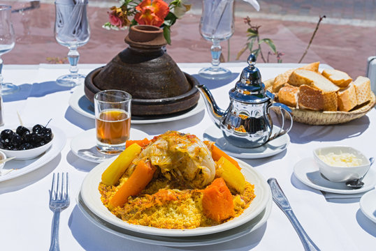 Moroccan traditional dinner: Kuskus, tajin, mint tea and olive.