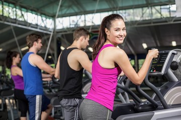 Fototapeta premium Fit people on elliptical bike