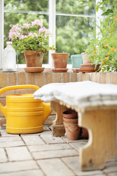 Watering can in conservatory