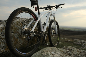 Fototapeta na wymiar Bicycle stands on a rock