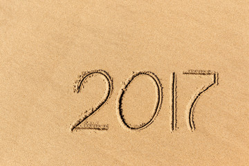 2017 year written on the beach sand