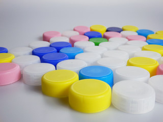 set of plastic bottle caps on white background