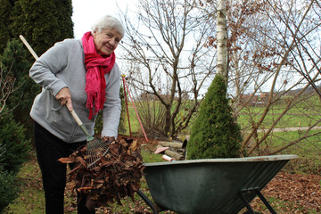 Elderly woman working in the garden