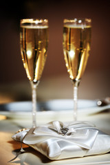 Close-up photo of stylish wedding glasses with champagne. 