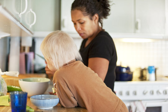 Mother with son preparing meal