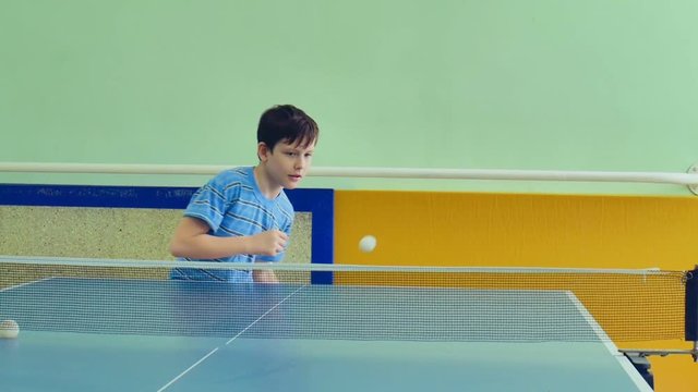 boy  playing table tennis slow motion video sport tops spin