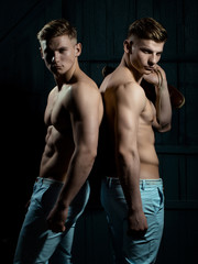 Fototapeta na wymiar Twins with muscular torso