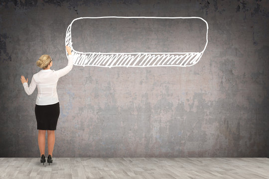 Business woman drawing on the wall. business concept
