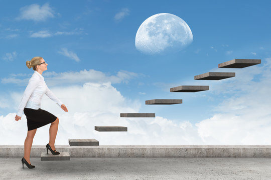 Business person stepping up a staircase. business concept
