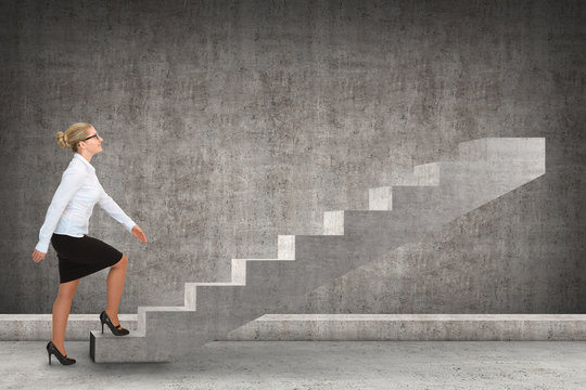 Business person stepping up a staircase. business concept
