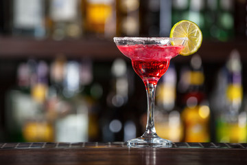 Cocktail garnished with lime.