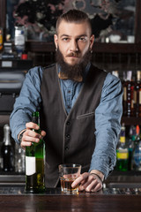 Barman serving cocktail.