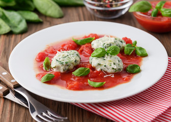 Homemade malfatti with tomato sauce