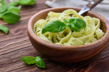 Pasta with chicken and vegetables on  wooden background