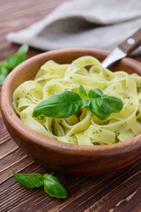 Pasta with chicken and vegetables on  wooden background