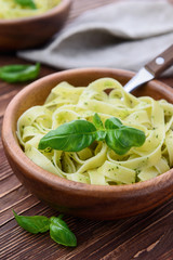 Pasta with chicken and vegetables on  wooden background