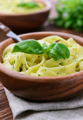 Pasta with chicken and vegetables on  wooden background
