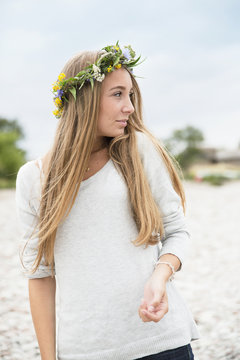 Teenage girl wearing flower wreath