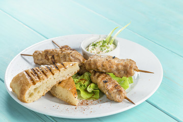 lula kebab serve fresh salad and pita bread