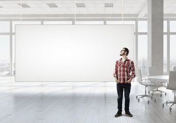 Fototapeta premium Student guy near banner