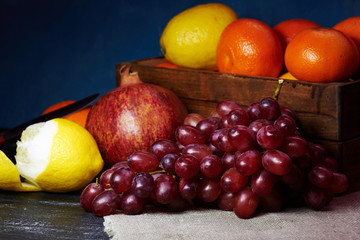 Classical composition: Basket of grapes, oranges and teapot
