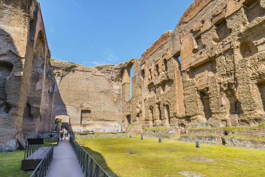 Scenic panoramic view on old swimming pool( or Natatio ) in the ruins of ancient Roman Baths of Caracalla ( Thermae Antoninianae ) at summer sunny day.Built between AD 212 - 217. Rome. Italy. Europe.